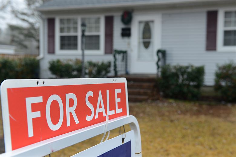 Home with a for sale sign, ready for listing after a seller’s inspection